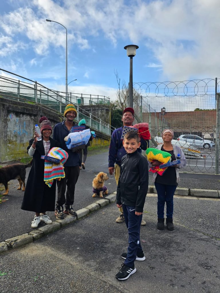 Zach gives to the homeless